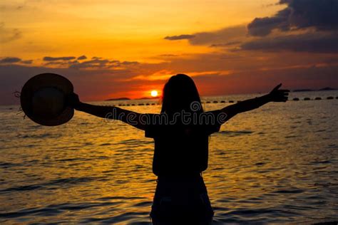 Silhouette Women Enjoying A Beautiful Sunset On The Beach Stock Image Image Of Enjoy Relax