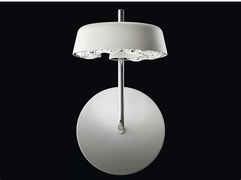 Shop different designs & sizes and find the perfect wall light for every room. INSIDE/OUT Wall lamp by Swarovski design Stephen Burks