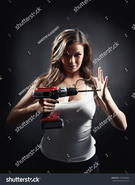 The Sexy Woman Holds An Electric Drill Stock Photo Shutterstock