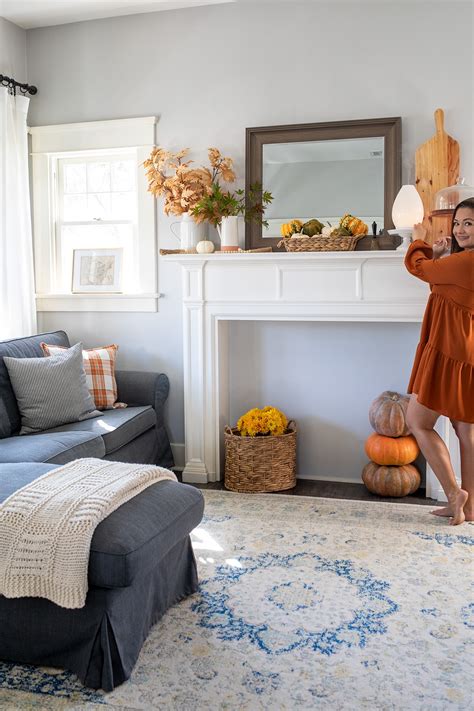 Simple additions like festive wreaths, dining room decor, and plaid pillows and blankets make a huge difference. Simple Fall Living Room Decor • Freutcake