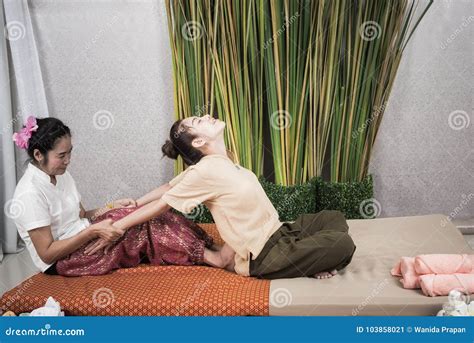 Thai Masseuse Doing Massage For Woman In Spa Salon Asian Beautiful