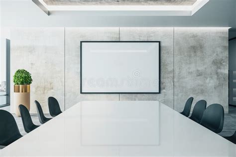 Meeting Interior With Long Conference Table And Projector Screen On
