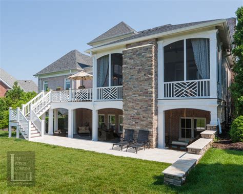 Second story deck pictures & ideas, composite. Two story double porch with outdoor fireplace, travertine ...