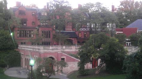An Old Red Brick Building Surrounded By Trees
