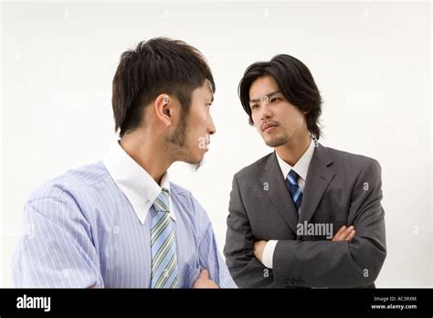 Two Businessmen Glaring At Each Other Stock Photo Alamy