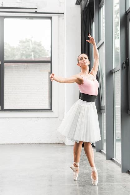 Free Photo Elegant Ballet Dancer Dancing In Dance Studio