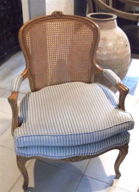 Check out our french caned chairs selection for the very best in unique or custom, handmade pieces from our shops. French cane back upholstered arm chair #French ...