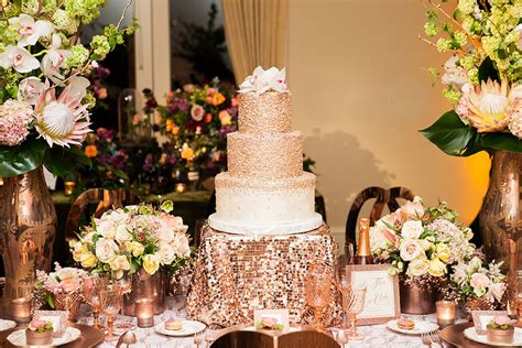 Decorate your four tier wedding cake with flowers and rose gold detailing for an extra special touch. Rose Gold Weddings