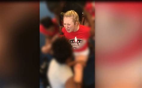 Watch Cheerleader Forced Into Splits By Coach