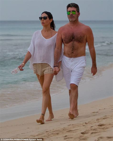 Simon Cowell And Lauren Silverman Enjoy A Romantic Stroll Together