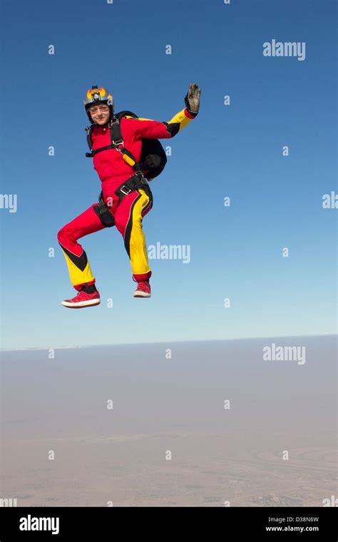 Woman Skydiving Over Clouds Stock Photo Alamy