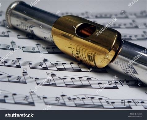 Flute With Gold Mouthpiece On Sheet Music Stock Photo 392801 Shutterstock