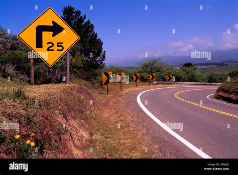 Speed Limit Road Sign Warning Drivers Of Sharp Right Curve Along