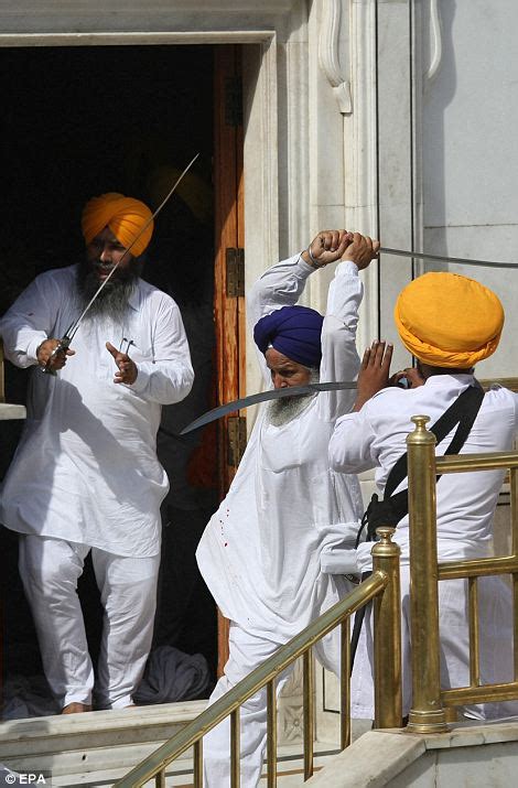 Sword Wielding Sikhs Clash At Indias Golden Temple During Prayers