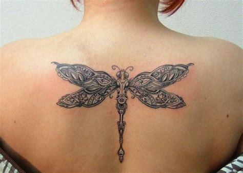 This tattoo shows a bunch of flowers around dragonfly and a butterfly. 16 Meaningful Tattoos That Show Your Ever-Changing Spirit ...