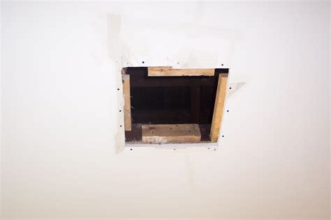 Hold the new drywall patch in place to check that it fits into the new hole easily without being forced. Drywall Repairs: Holes Can Be Disappeared | Painting In ...