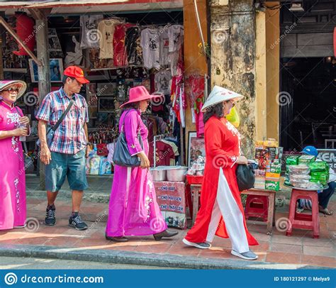 local-women-walk-downtown-in-a-traditional-costume-for-a-woman-in-vietnam-editorial-photography