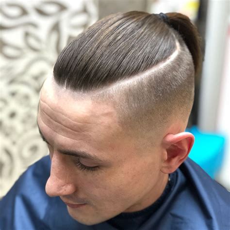 Shaved sides long top ponytail. Pin on Braids Vikings