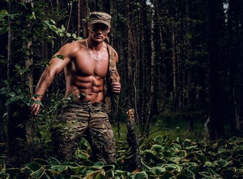 Premium Photo Brutal Muscular Man In Military Uniform And Naked Torso