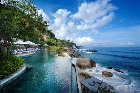 Infinity Pool Nestled Into A Cliffside Next To The Ocean Bali Resort