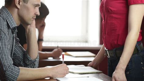 Educational Theme Portrait Of A Teacher Giving A Lecture Busty Teacher In Front Of Male