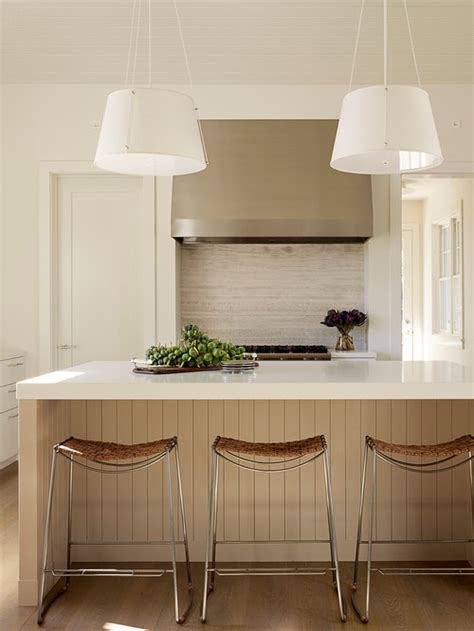 Modern wooden cabinets with a black countertop and neutral. Six Reasons to Fall in Love with Wood Panelling All Over Again