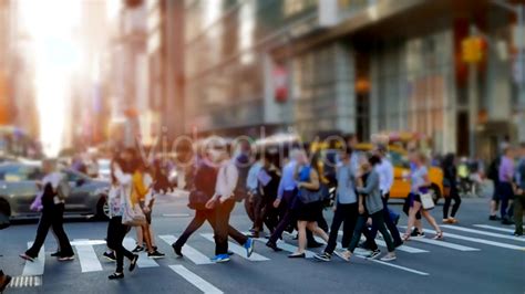 Crowd Of People Walking On Busy City Street At Rush Hour Traffic