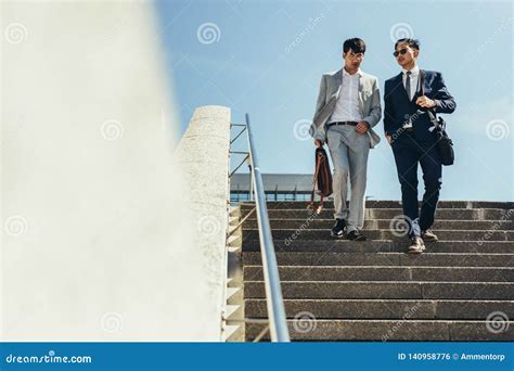 Business Men Talking And Walking Down The Steps Stock Photo Image Of