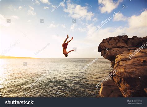Cliff Jumping Into Ocean Sunset Outdoor Stock Photo Edit Now 344995145