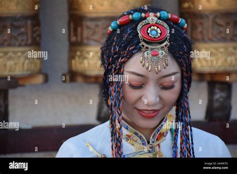 Beautiful Asian Girl Taking Photo Shoot Dressed With Traditional Tibetan Clothes In Barkhor