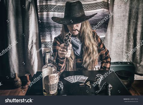 Cowgirl Gunslinger Sitting Aiming Old West Stock Photo