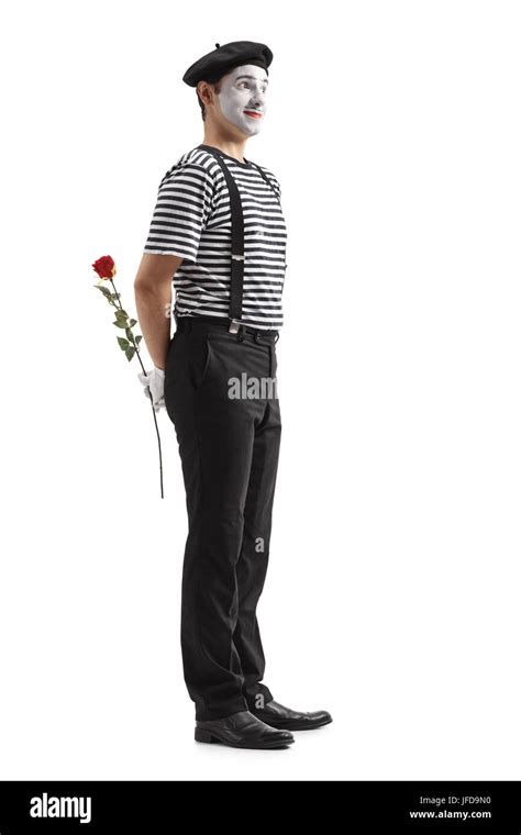 Full Length Profile Shot Of A Mime With A Rose Waiting In Line Isolated