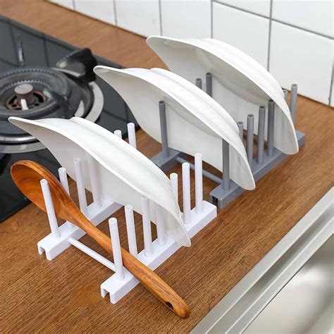 Keep your cutting boards, trays, and butcher blocks organized and easily accessible on the kitchen countertop. Dish Racks Plastic dish lid rack kitchen supplies storage ...