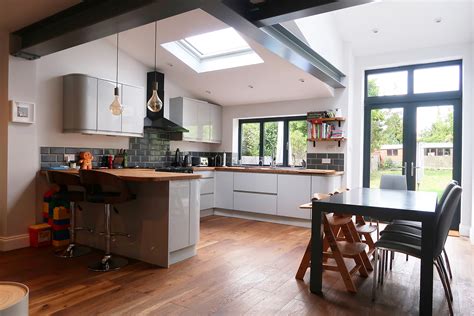 Remodeled white kitchen with vaulted ceiling beams. Testimonials - Keeps Architect - Joaquin Gindre | Keeps ...