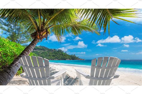 Beach Chairs Under Coconut Palm Nature Stock Photos ~ Creative Market