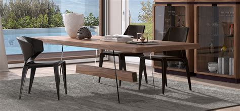 Dining room tables come in a range of shapes and configurations. Phantom | NATUZZI ITALIA