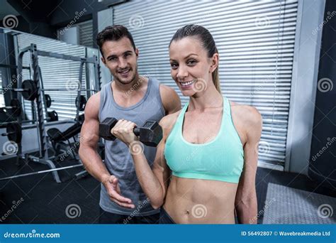 A Muscular Woman Lifting Dumbbells Stock Image Image Of Adult