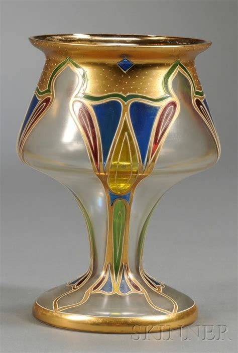 An Ornate Glass Vase With Gold Trimming