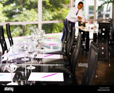 Waiter Setting Up Table For Customer Stock Photo Alamy