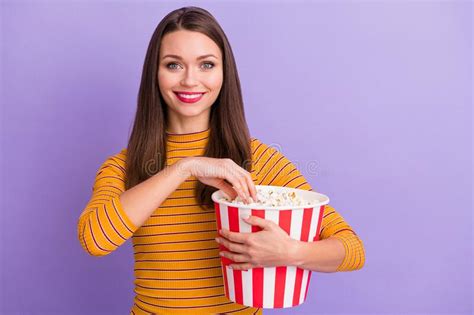 Portrait Of Charming Lovely Cute Sweet Girl Hold Pop Corn Striped Box Eat Watching Interesting