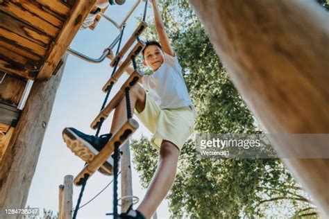 Young Boy Climbing Ladder Photos And Premium High Res Pictures Getty