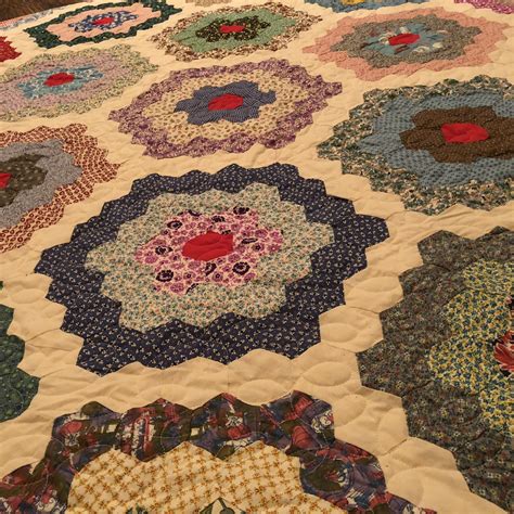 The block is attributed to aunt martha studios. Grandmothers flower garden quilted with digital design ...