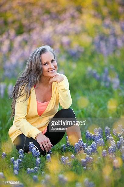 Woman Kneeling In Garden Photos And Premium High Res Pictures Getty