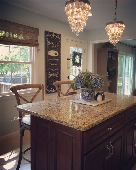Your kitchen is one of the main areas of your home where your loved ones make meals for you. Small kitchen, pottery barn chandeliers over island ...