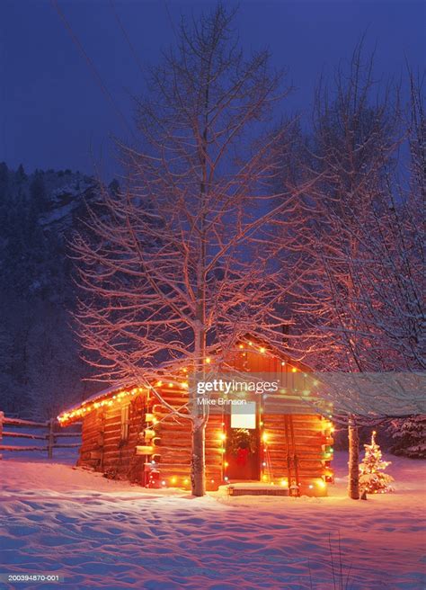 Log Cabin Exterior Decorated With Christmas Lights Winter