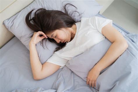 Asian Woman Lying Asleep On White Pillows On Bed Stock Image Image Of