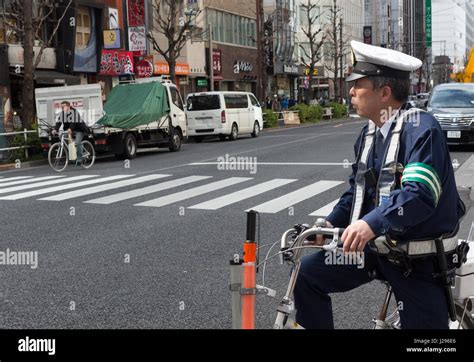 Tokyo Japan April 8th 2017 Japanese Policeman Sitting On A Bicycle