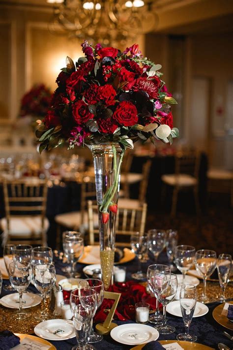 This centerpiece could be used for any part of your ceremony or it was an outside wedding and there were lanterns (similar to the one above) decorated with red roses. Tall centerpiece ideas, red roses, gold accents, calla ...