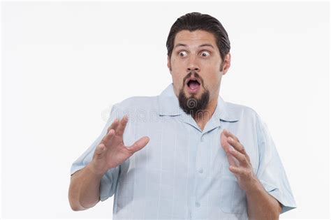 Legend holds stories of people being so scared their hair turns white, but science says differently. Image Of A Scared Young Man Standing Against White Stock ...