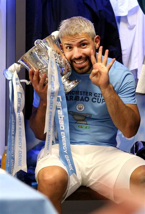 Sergio Aguero Of Manchester City Celebrates Victory With The Trophy